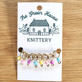 multicoloured pastel glass bead ring-style stitch markers in the spring flowers colour with gold wire